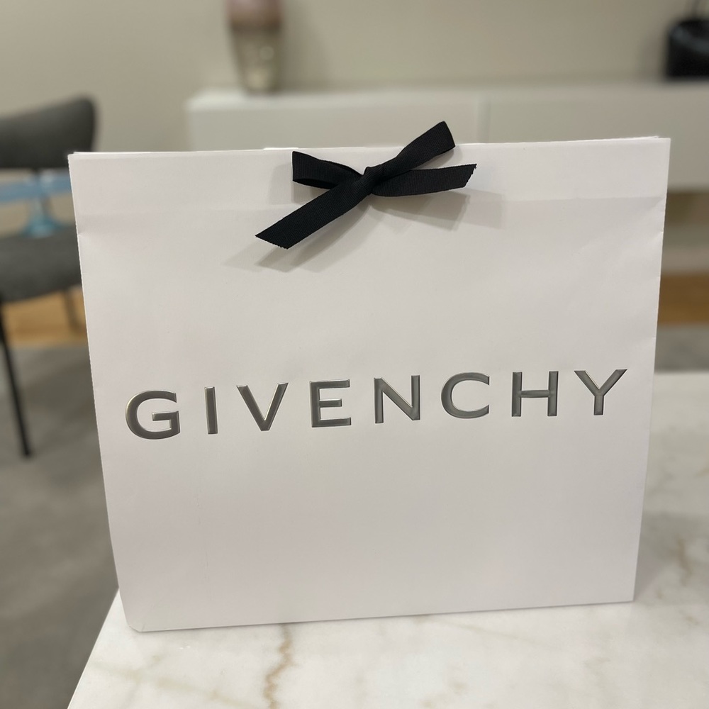 Givinchy purchase gift bag with tissue paper .